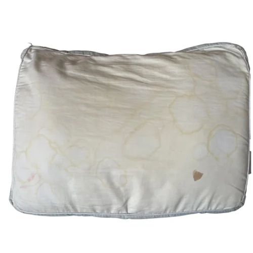 Sweaty, stained old pillow